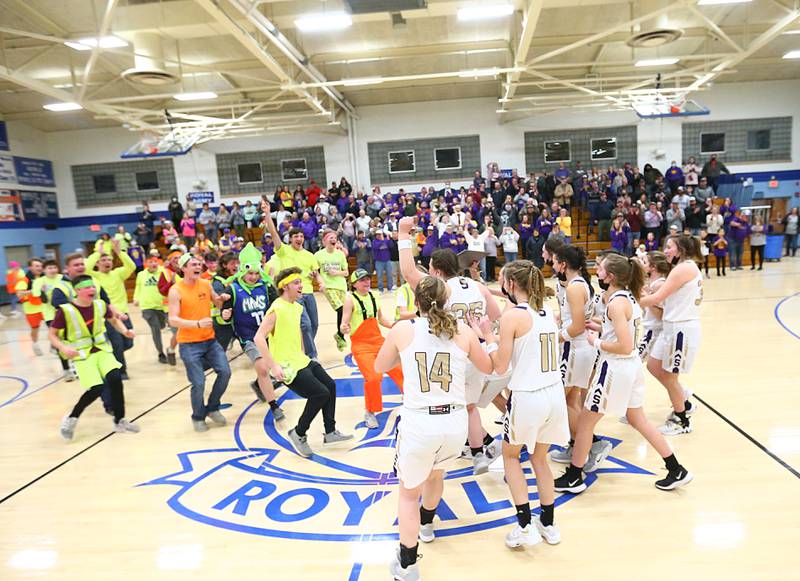 Serena super fans celebrate with the Lady Husker girls basketball team after defeating Newark in the Class 1A Sectional final game on Thursday, Feb. 24, 2022, in Hinckley.