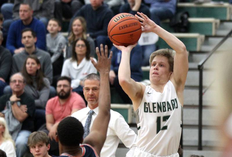 Glenbard West’s Andrew Dauksas shoots the ball during a Class 4A Bartlett Sectional semifinal game against Naperville North on Tuesday, March 1, 2022.