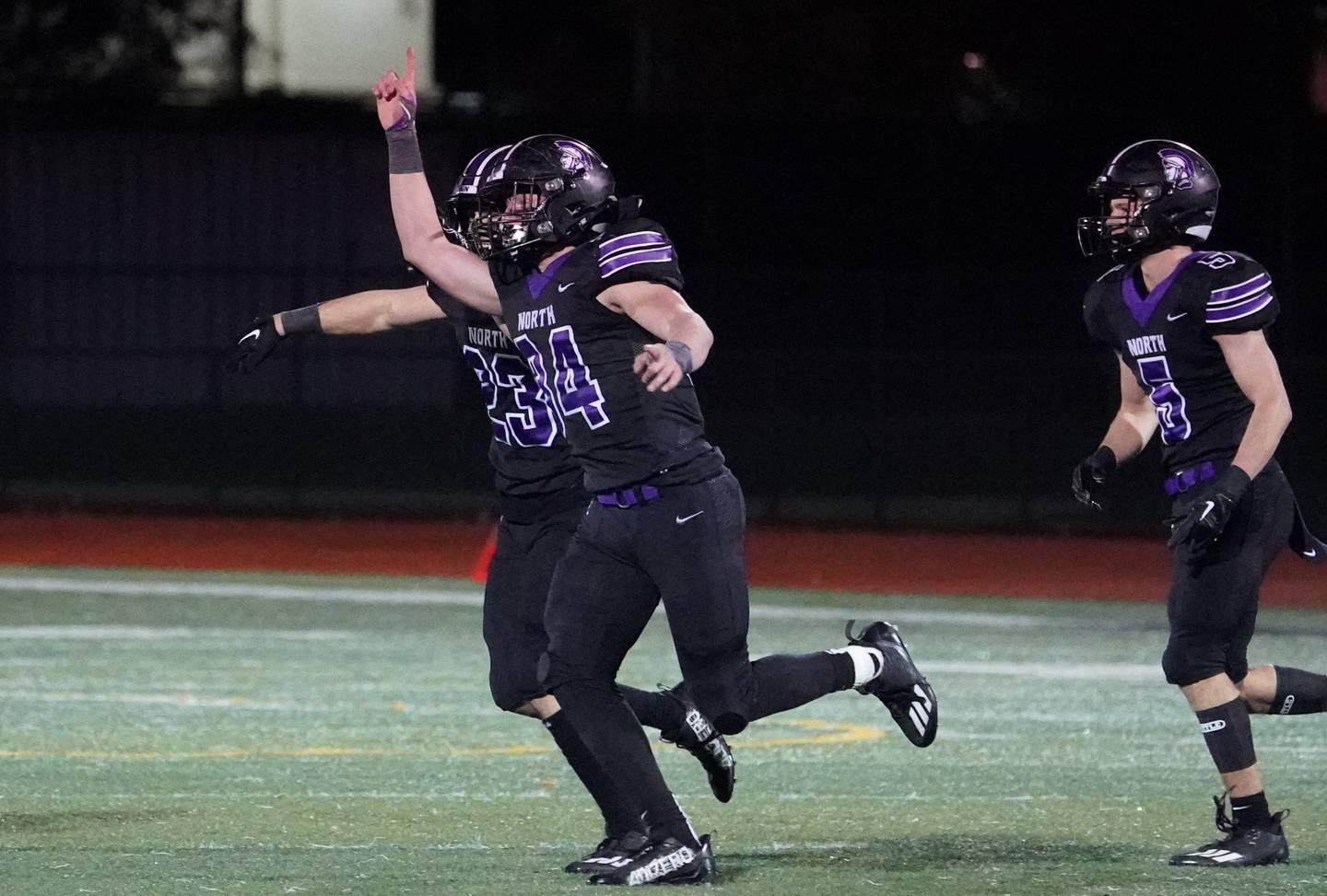 Downers Grove North's Jake Gregorio (34) celebrates after intercepting a pass against Kenwood during a class 7A playoff football game at Downers Grove North on Friday, Oct. 27, 2023.
