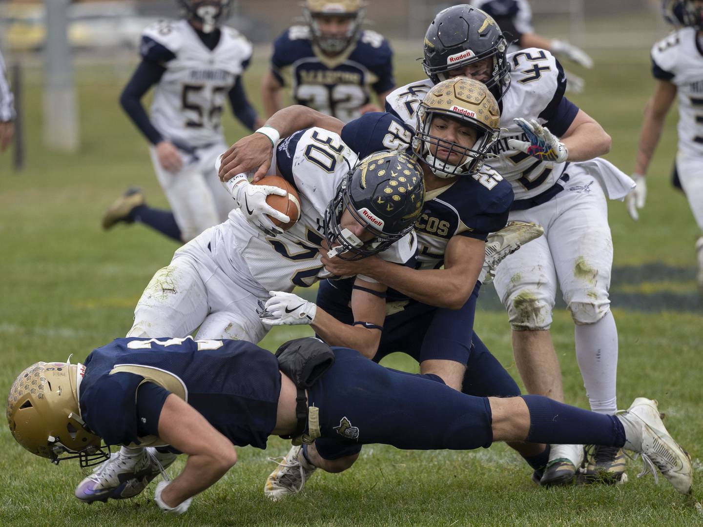 Polo’s Quinton Hart grabs a hold of Hiawatha’s Tim Pruitt  Saturday, Nov. 1, 2025, in the 8-man football playoff quarterfinals.