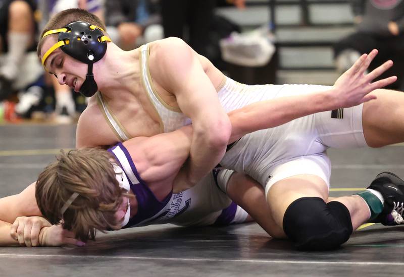Sycamore’s Gus Cambier works to turn Rochelle’s Grant Gensler during their 152 pound championship match Saturday Jan. 21, 2023, during the Interstate 8 Conference wrestling tournament at Sycamore High School.