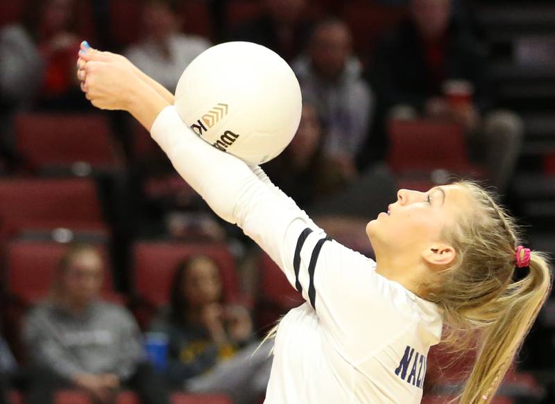 Nazareth Academy's libero Reese Butkus hits the ball back to the Taylorville side of the net in the Class 3A semifinal game on Friday, Nov. 11, 2022 at Redbird Arena in Normal.