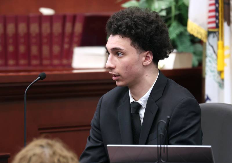 Hamza Khatatbeh, 17, formerly of Sycamore, answers questions from special prosecutor Derek Dion during cross examiniation while he testifies in his own defense Thursday, Feb. 19, 2026, during the second day of his murder trial at the DeKalb County Courthouse in Sycamore. Khatatbeh is accused of fatally stabbing Sycamore 17-year-old Kaleb McCall in 2023.