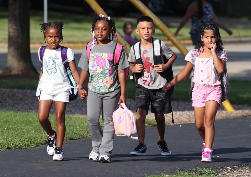 Lincoln Elementary School students arrive for their first day Wednesday, Aug. 14, 2024, at the school in DeKalb.