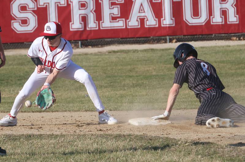 Streator's Maddan McCloskey fields a late throw to second base as Hall's Braden Curran slides in safely to the bag on Thursday, March 19, 2026 at Streator High School.