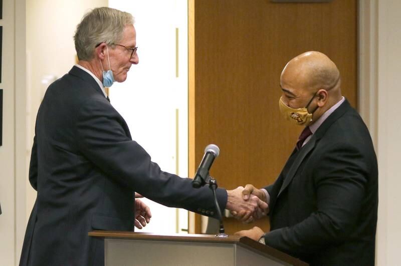 DeKalb City Manager Bill Nicklas greets Illinois State Police Col. David Byrd during the DeKalb City Council meeting Monday after Byrd was named as the city's next police chief. DeKalb City Manager Bill Nicklas greets Illinois State Police Col. David Byrd during the City Council meeting Monday after announcing Byrd was the citizen-led search committee’s choice to be the next police chief of DeKalb.