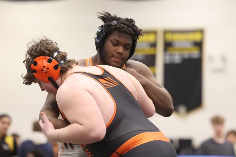 Jamir Thomas of Romeoville works against Robbie Murphy of Minooka in the 285-pound weight SPC Conference championship match at Joliet West on Saturday, Jan 25, 2025.