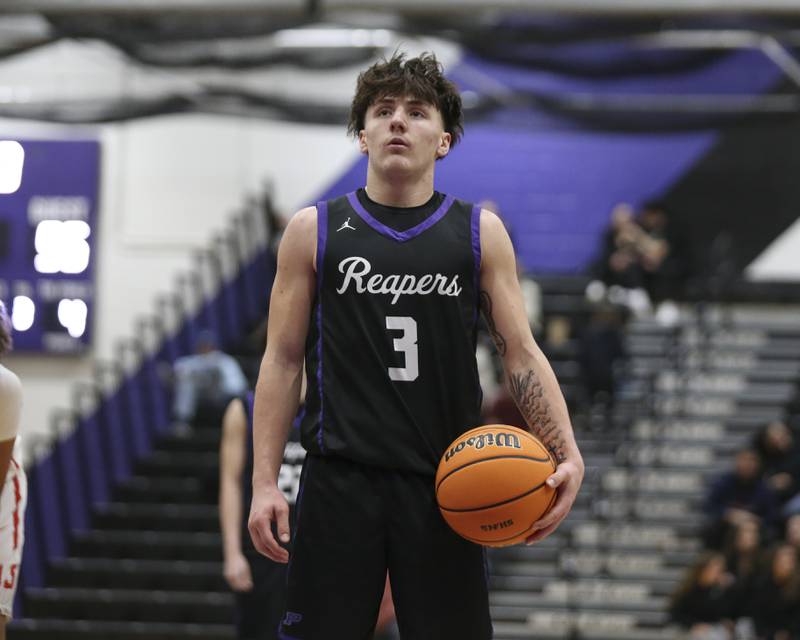 Plano's Ethan Taxis (3) looks at the rim before shooting a free throw to help seal their Plano Christmas Classic basketball game between Streator at Plano Friday, Dec 26, 2025 in Plano.
