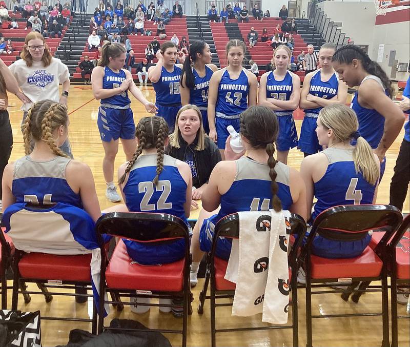 Princeton coach Darcy Kepner huddles up the Tigresses during Monday's game at Hall. PHS beat the rival Red Devils, 46-32, to improve to 8-0 a top the TRAC East.