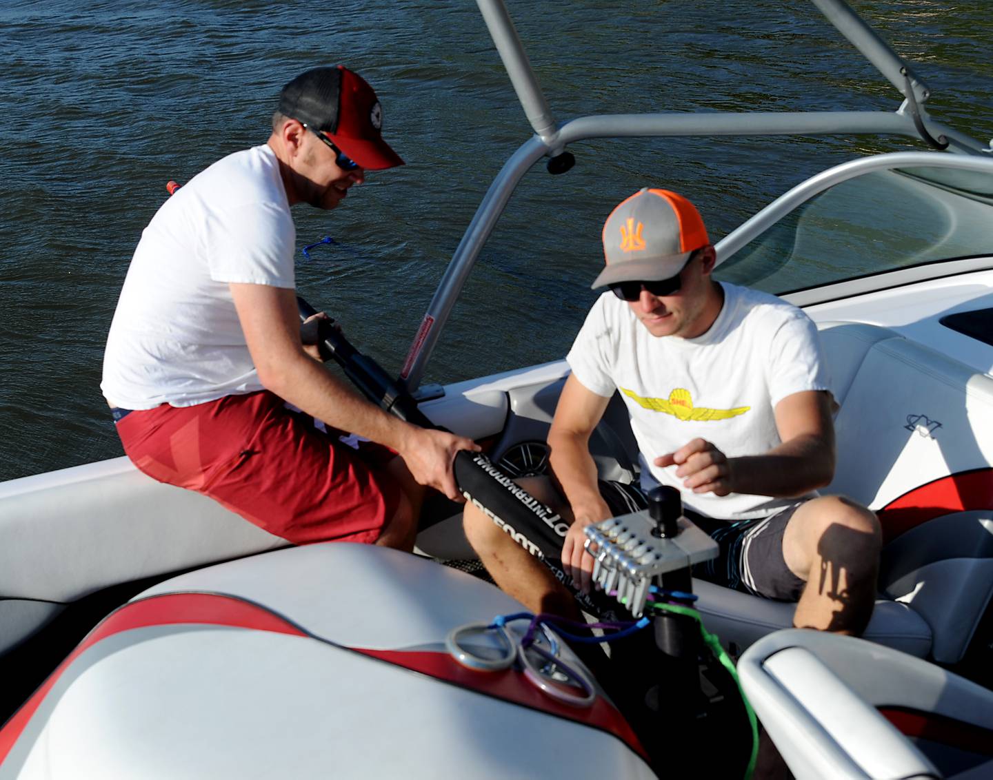 Jamie O’Conner and Fred DeWitt add adaptive ski equipment to a boat Tuesday, June 21, 2022, before the Wonder Lake Water Ski Show Team and Northern Illinois Special Recreation Association’s performance on Wonder Lake. The performance was the end of the team’s learn to ski clinic. Members of ski team have constructed adaptive water ski equipment, which has proven year after year to be successful in allowing every participant to be able to water ski.