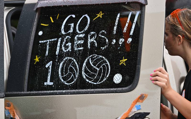 Members of the Crystal Lake Central H.S. girls volleyball team begin loading into their parade vehicle at the start of the school's 100th anniversary homecoming day celebration parade that featured alumni from various graduating classes on a rainy Saturday, Sep. 16, 2023 in Crystal Lake. The parade began at the high school and made its way through downtown Crystal Lake.