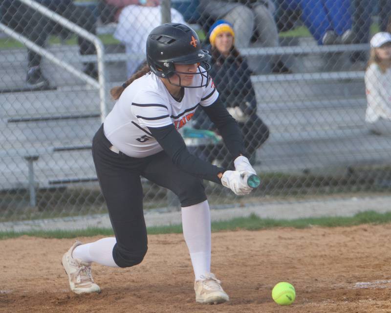 St. Charles East's Alyssa Powers lays down a bunt against Wheaton North on Monday, April 21, 2025 In Wheaton.