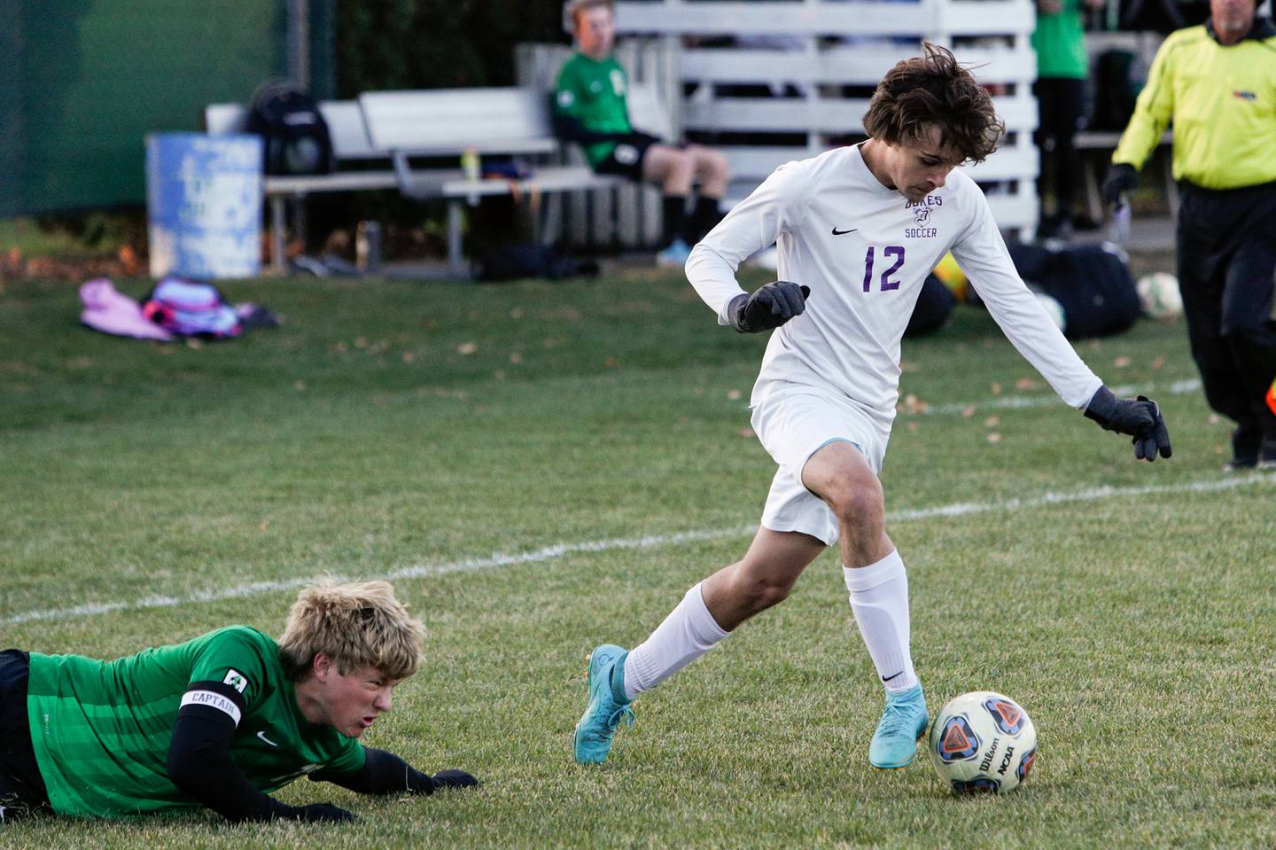 Dixon's Jacob Duet (12) dribbles the ball after evading Geneseo's Alex Slaymaker (17) during the second half of an IHSA class 2a boys soccer match, Tuesday, Oct. 18, 2022, in Geneseo.
