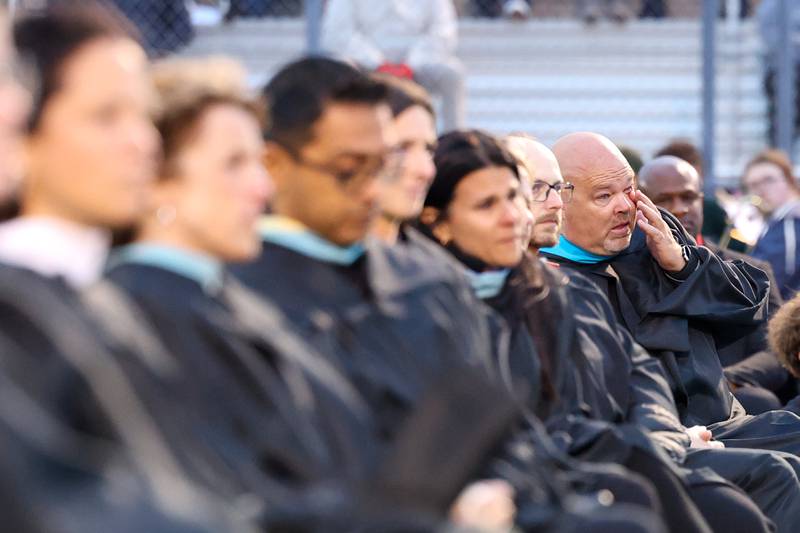 Mike Kohl wipes away a tear as his nephew, Calvin Kohl, shares about the loss of his grandfather in his speech during the Bradley-Bourbonnais Community High School commencement ceremony on Thursday, May 21, 2026.