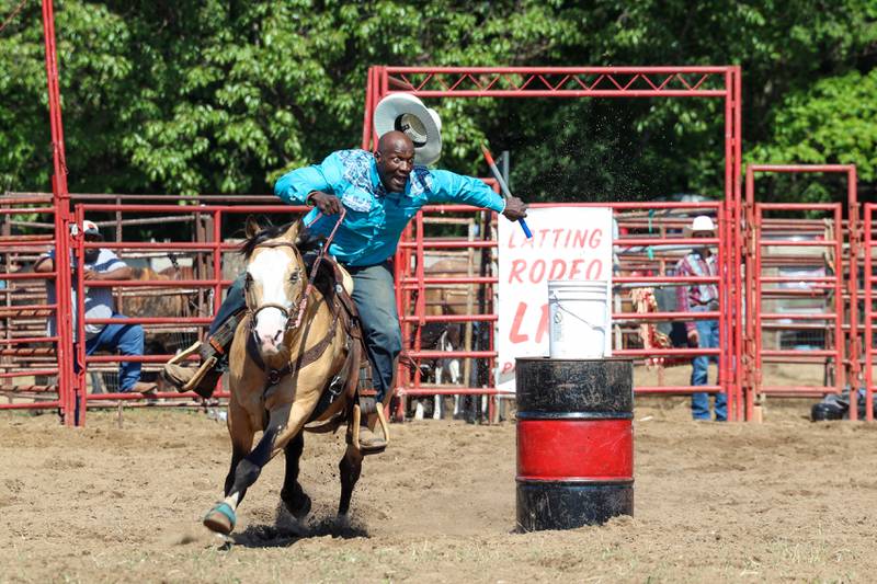 Q. Crecy, of Aroma Park, intensely secures a baton as he competes during the 50th Pembroke Rodeo on Sunday, May 24, 2026.