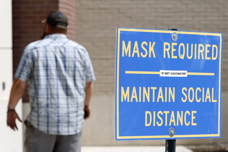 A man walks into the Michael J. Sullivan Judicial Center on Thursday, Aug. 26, 2021, in Woodstock.