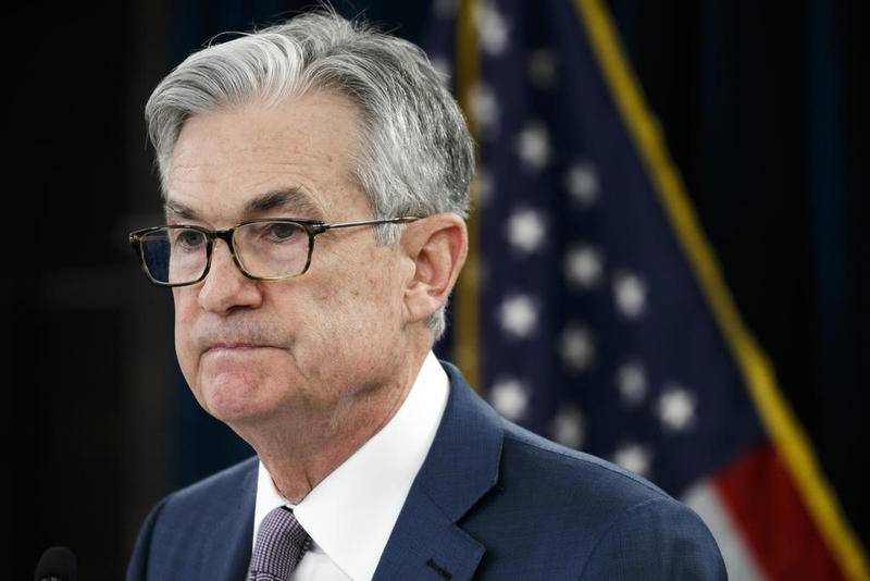Federal Reserve Chairman Jerome Powell pauses March 3 during a news conference to discuss an announcement from the Federal Open Market Committee in Washington. The Federal Reserve said on Wednesday that it will keep buying bonds to maintain low borrowing rates and support the U.S. economy in the midst of a recession.
