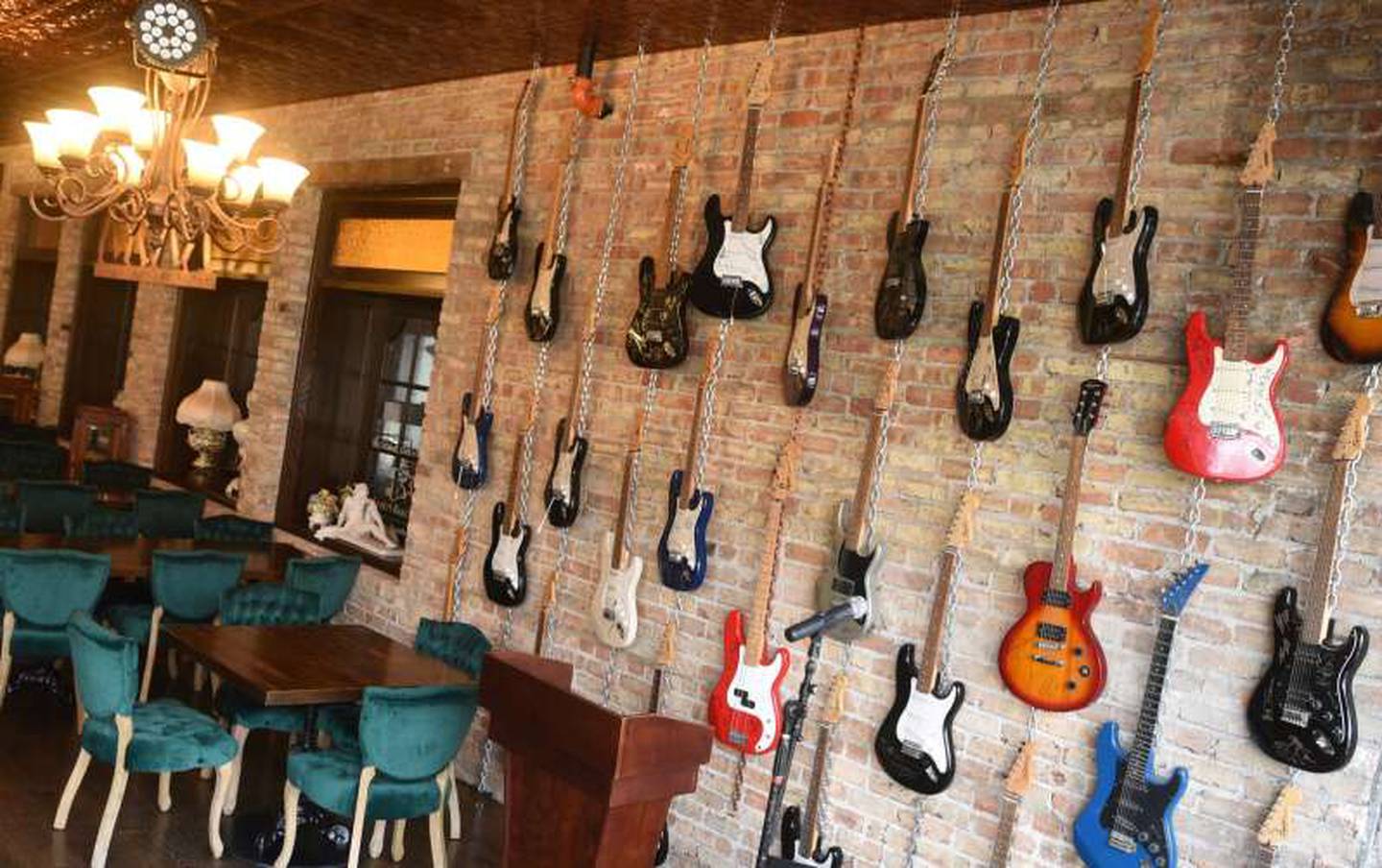 A collection of signed guitars lines one wall of Rock ’N Ravioli in St. Charles.