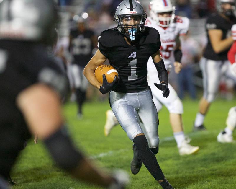 Kaneland's Evan Frieders carries the ball for a gain against Ottawa on Friday, Sept. 22, 2023 in Maple Park.