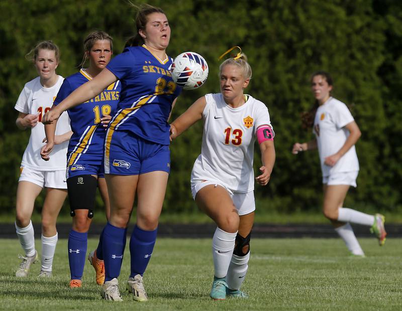 Johnsburg's Kiara Welch tries to control the ball in front of Richmond-Burton's Jordan Otto during the IHSA Class 1A Marian Central Sectional Championship match on Tuesday, May 21, 2024, at Marian Central High School.