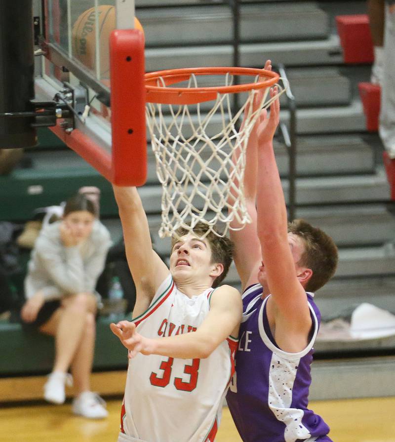L-P's Gavin Stokes scores on a layup as Rochelle's Eli Schweitzer defends on Friday, Feb. 13, 2026 in Sellett Gymnasium at L-P High School.