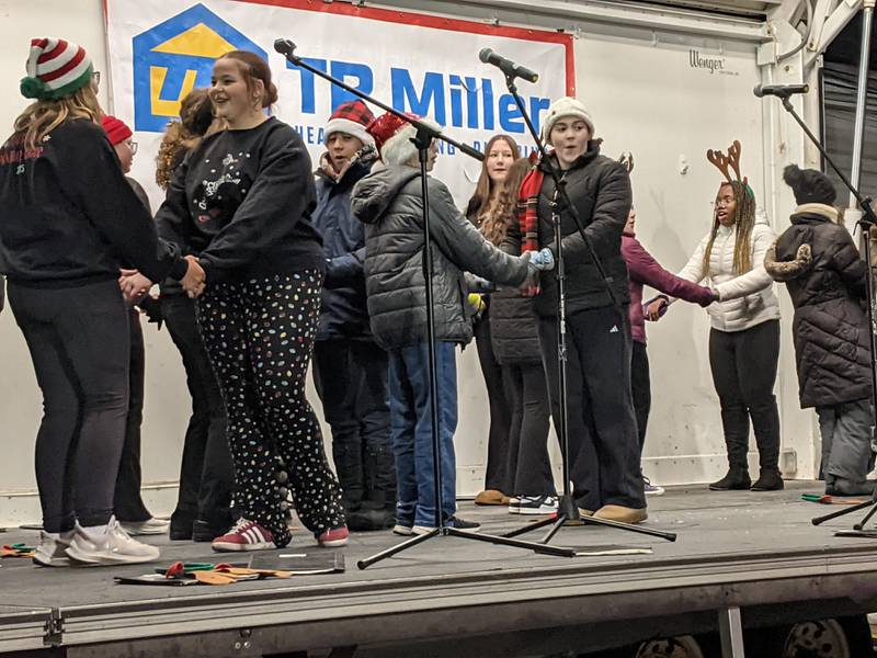 The Traughber Junior High School Chorus performs at the Oswego Christmas Walk on Friday, Dec. 5, 2025.