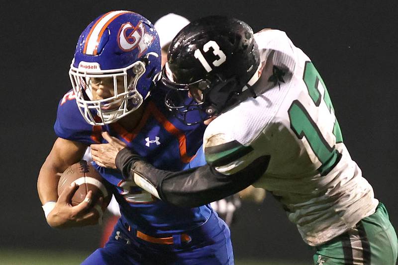 Genoa-Kingston's Tyler Atterberry tries to break free from Rock Falls' Richard Nichols during their game Friday, Oct. 13, 2023, at Genoa-Kingston High School.