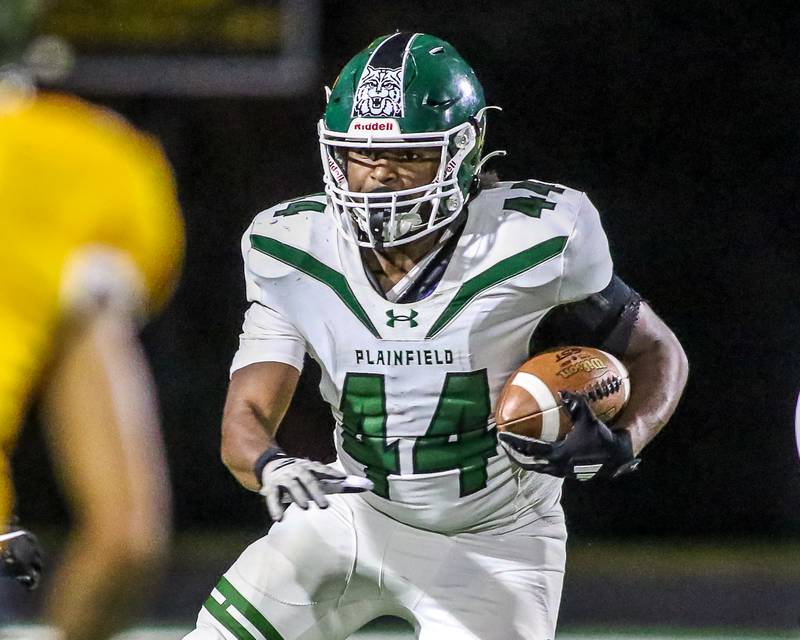 Plainfield Central's Josiah Taylor (44) runs with the ball during a football game between Plainfield Central at Joliet West on Friday, Oct 25th, 2024  in Joliet.
