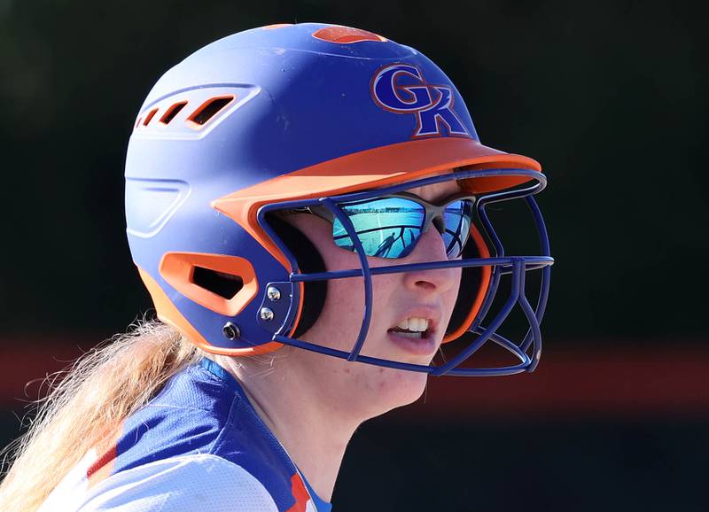 Genoa-Kingson's Kiearah Mitchell looks in at the batter as she gets ready to run from third base during their game Friday, March 15, 2024, at Genoa-Kingston High School.