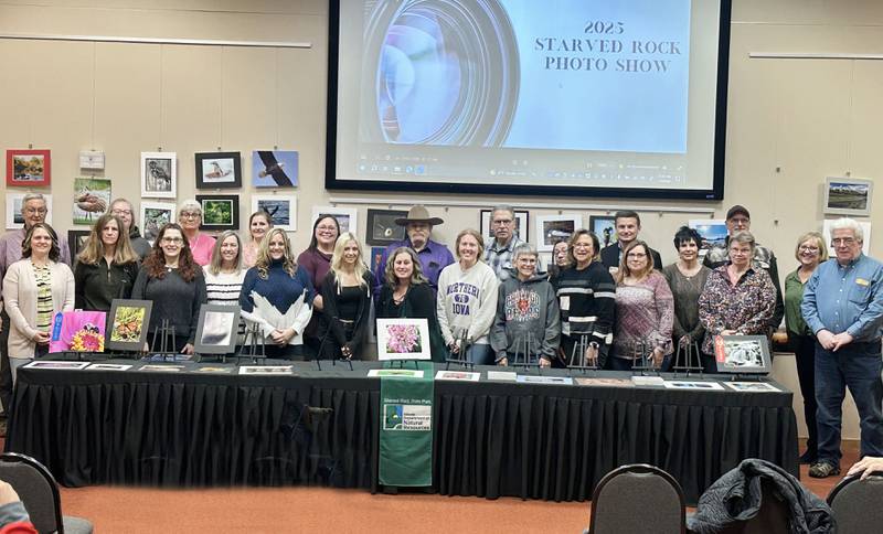 Participants gather for a group photo during the Starved Rock Photography Show awards on Saturday, Jan. 3, 2026 at the Starved Rock Visitors Center. The show brought in 86 entries were submitted for this years show.