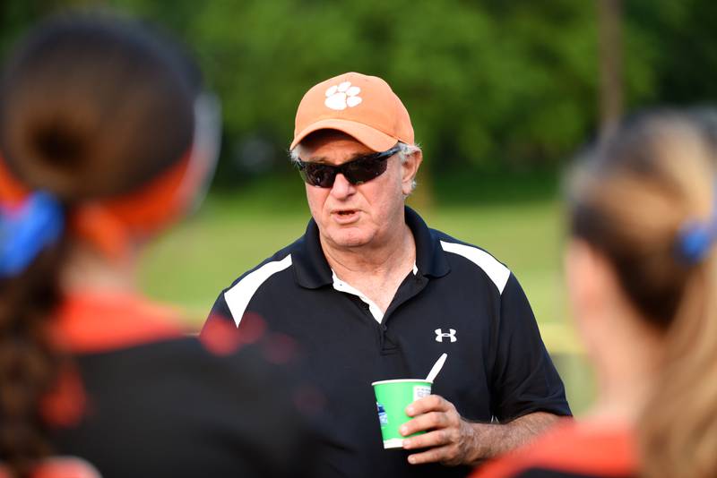 Beecher softball coach Kevin Hayhurst addresses the Bobcats following their 4-3 10-inning win against Brimfield in the Class 2A East Peoria Super-Sectional Monday, June 2, 2025.