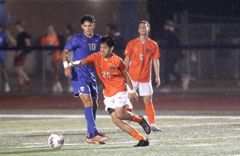 St. Charles East’s Santi Porcayo goes after the ball during a Tri-Cities Night game against St. Charles North at St. Charles North on Thursday, Sept. 21, 2023.