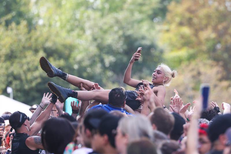 A fan takes a selfie crowd surfing during the Hot Mulligans performance on the Radicals stage on day one of Riot Fest. Friday, Sept. 17, 2022, in Chicago.