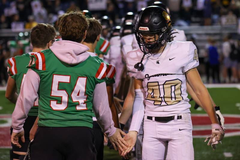 Football players of L-P and Sycamore high five after game on Friday, October 11, 2024 at Howard Fellows Stadium in LaSalle.