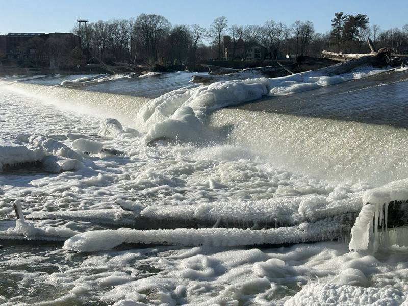 Winter has returned to the Oregon area as evidenced by the ice clinging to fallen trees that are stuck on the Oregon dam on Tuesday, Jan. 14, 2025. The cold temperatures are forecast to last through the week.