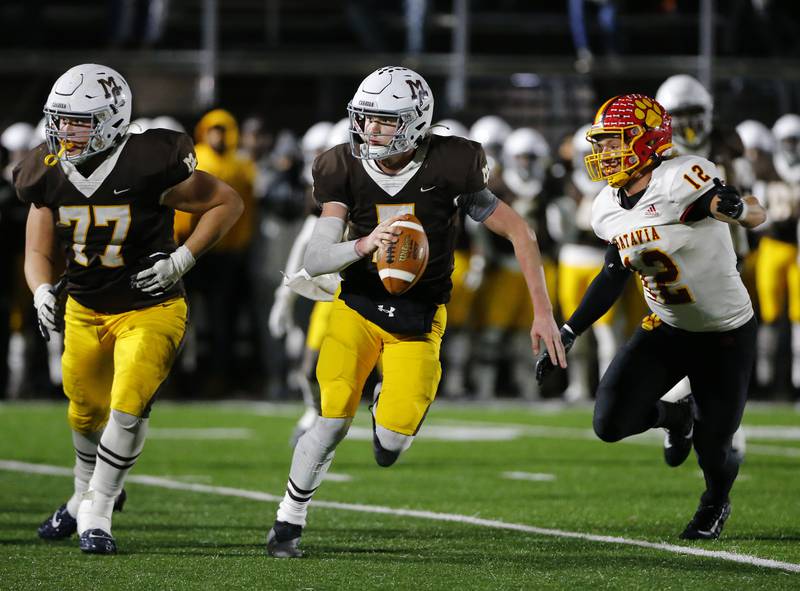 Mt. Carmel's Blainey Dowling looks for a receiver down field during the IHSA Class 7A  varsity football playoff game between Batavia and Mt. Carmel on Friday, November 5, 2021 in Chicago.