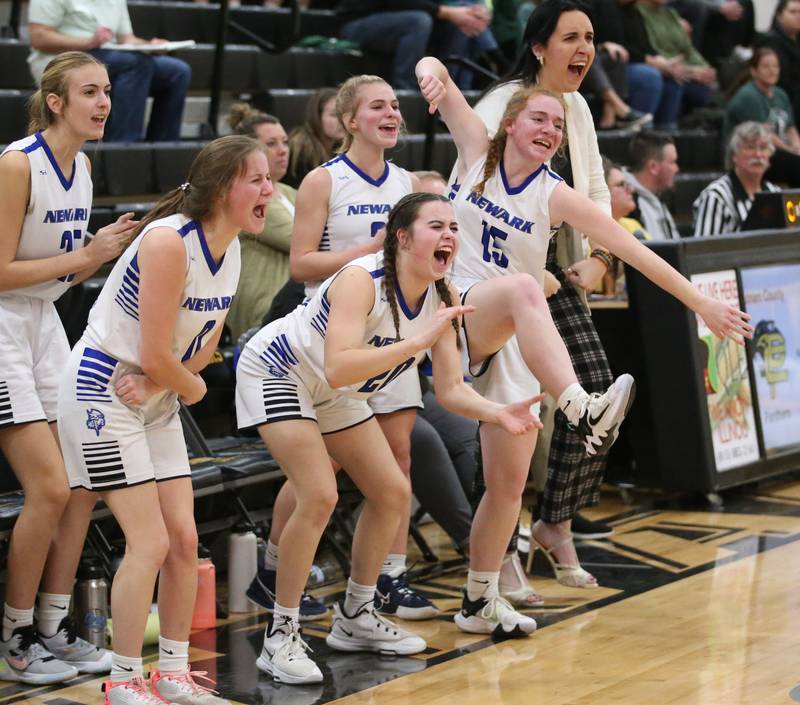 Members of the Newark basketball team cheer after their team scores a basket against St. Bede during the Class 1A Regional game on Monday, Feb. 13, 2023 at Putnam County High School.