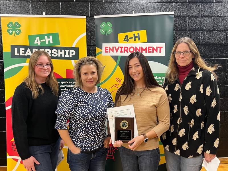 The 2023 4-H Alumni Award posthumously honored 4-H leader Shelley Mroz, who passed away this summer. 4-H graduate Jenna Buss spoke about Mroz, and accepting the award were her daughters Erin Mroz and Mandy Bark, along with co-leader Debbie Granat.