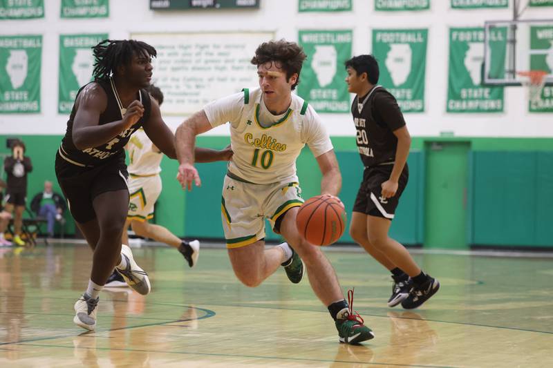 Providence’s Max Clarke makes a move to the basket against Joliet Catholic on Saturday, Dec. 9th, 2023 in New Lenox.