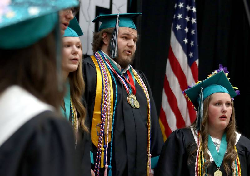 Members of the Class of 2025 perform the national anthem during graduation at Woodstock North High School in Woodstock on Saturday, May 17, 2025.