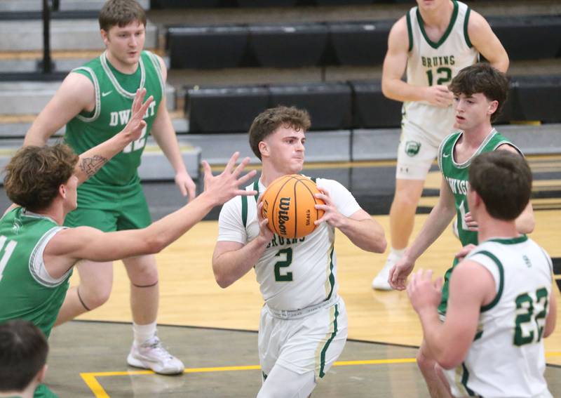 St. Bede's Gus Burr looks to pass as he is surrounded by Dwight defenders cutting in the lane during the Tri-County Conference Tournament on Tuesday, Jan. 27, 2026 at Putnam County High School.