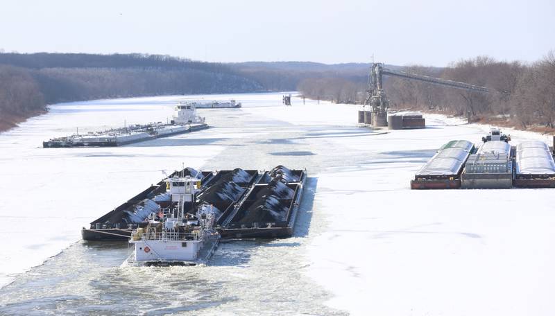 The Ned Merrick barge cuts through icy waters of the Illinois River on Tuesday, Jan. 27, 2026 near Utica. The Illinois River is nearly frozen over. With temperatures staying in the sub-zero range it has allowed the Illinois River to freeze. Normal temperatures are forcasted next week.