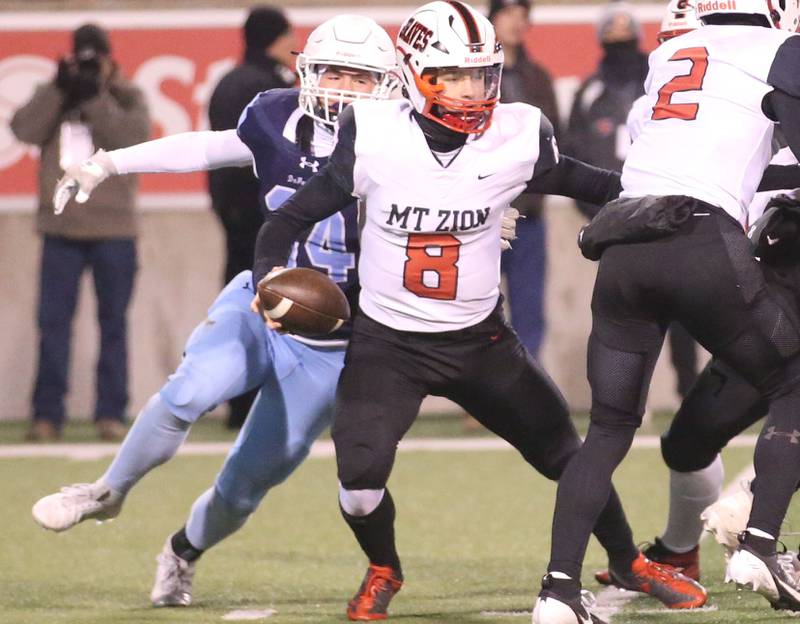 DePaul's Michael Casper sacks Mt. Zion quarterback Keller Stocks during the Class 4A State football championship on Friday, Nov. 29, 2024 at Hancock Stadium in Normal.