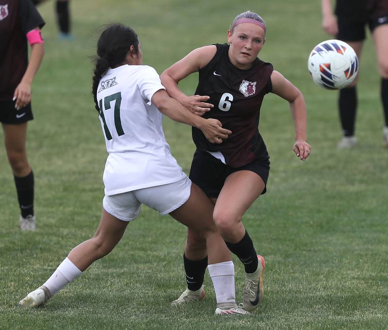 Prairie Ridge's Maelyn Growney tries to chase down the ball as she is defended bu Crystal Lake South's Abigail Magadan during a Class 2A Crystal Lake Central Regional girls soccer semifinal match on Tuesday, May 19, 2026, at Crystal Lake Central High School.