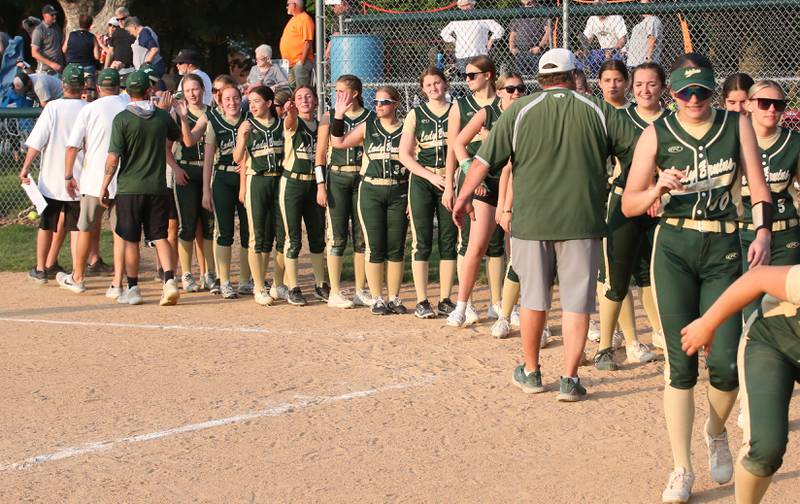 Members of the St. Bede softball team hi-five each other after defeating Ridgewood AlWood/Cambridge in the Class 1A Sectional semifinal game on Tuesday, May 23, 20223 at St. Bede Academy.