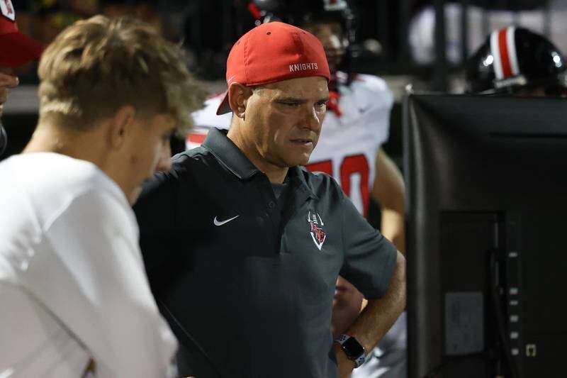Lincoln-Way Central head coach Dave Woodburn looks at film during the game against Providence on Friday, Sept. 6, 2024 in New Lenox.