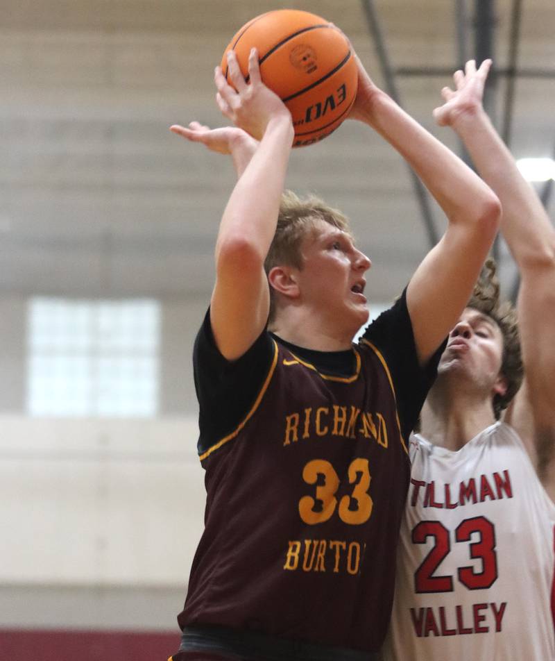 Richmond-Burton’s Luke Robinson, left, shoots as Stillman Valley’s Fadi Zatar defends during 74th Annual E.C. Nichols Holiday Classic varsity boys basketball tournament action on Saturday, Dec. 28, 2024 at Marengo High School in Marengo.