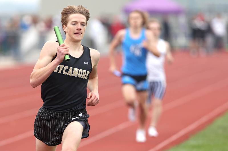 Sycamore's Caden Emmert runs the final leg of the 4x800 meter relay for his team Wednesday, May 18, 2022, at the Class 2A boys track sectional at Rochelle High School. Sycamore finished second to Sterling.