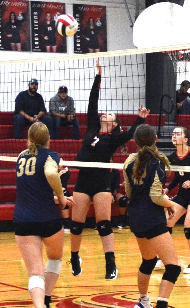 LaMoille's Aubrey Sadnick takes a hit against Hiawatha Tuesday at Dean Madsen Gymnasium at LaMoille.