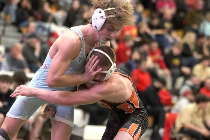 Marian’ Central's Austin Hagevold, left, battles Washington’s Cayden Park at 144 pounds in varsity boys wrestling on Thursday, Feb. 5, 2026, at Sycamore High School in Sycamore.